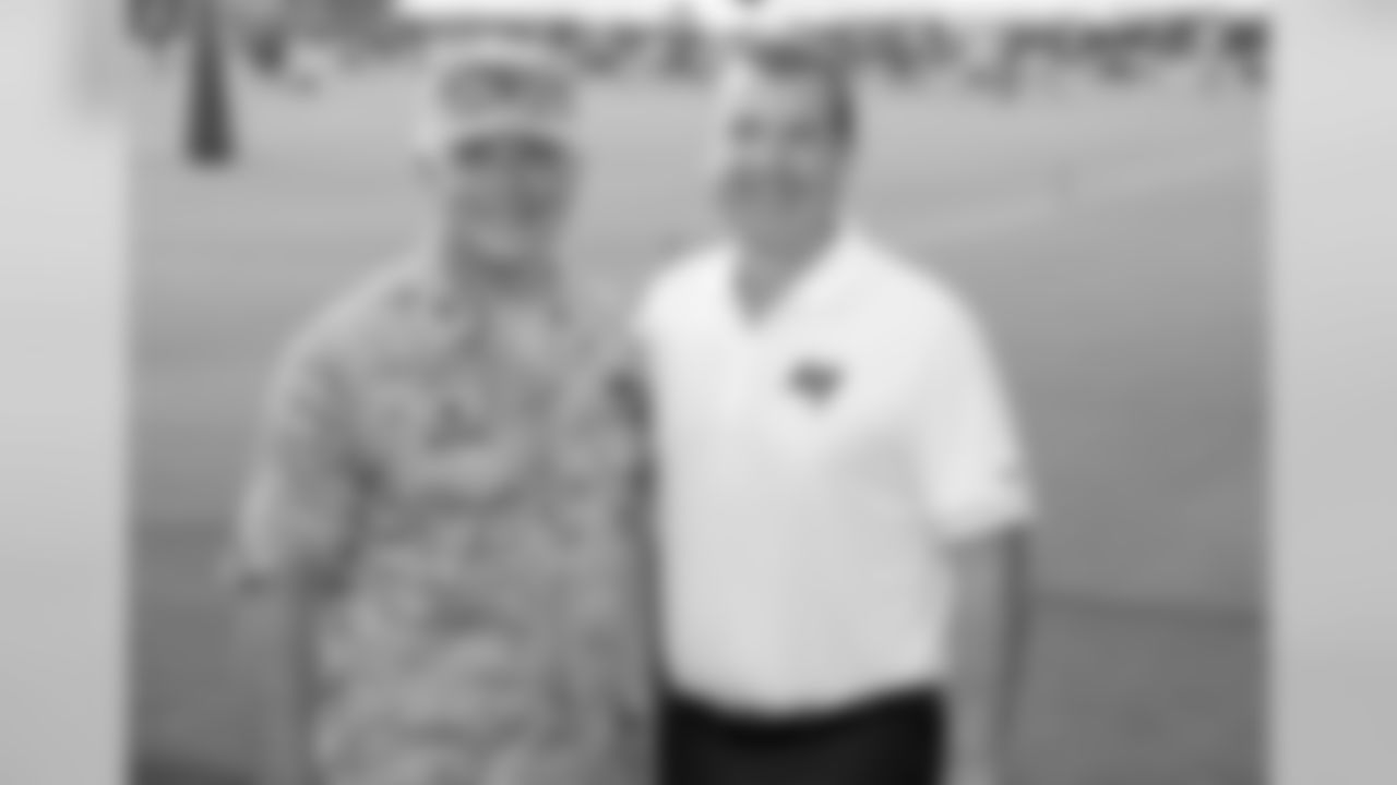Chief Operating Officer Brian Ford with Military member at Training Camp.