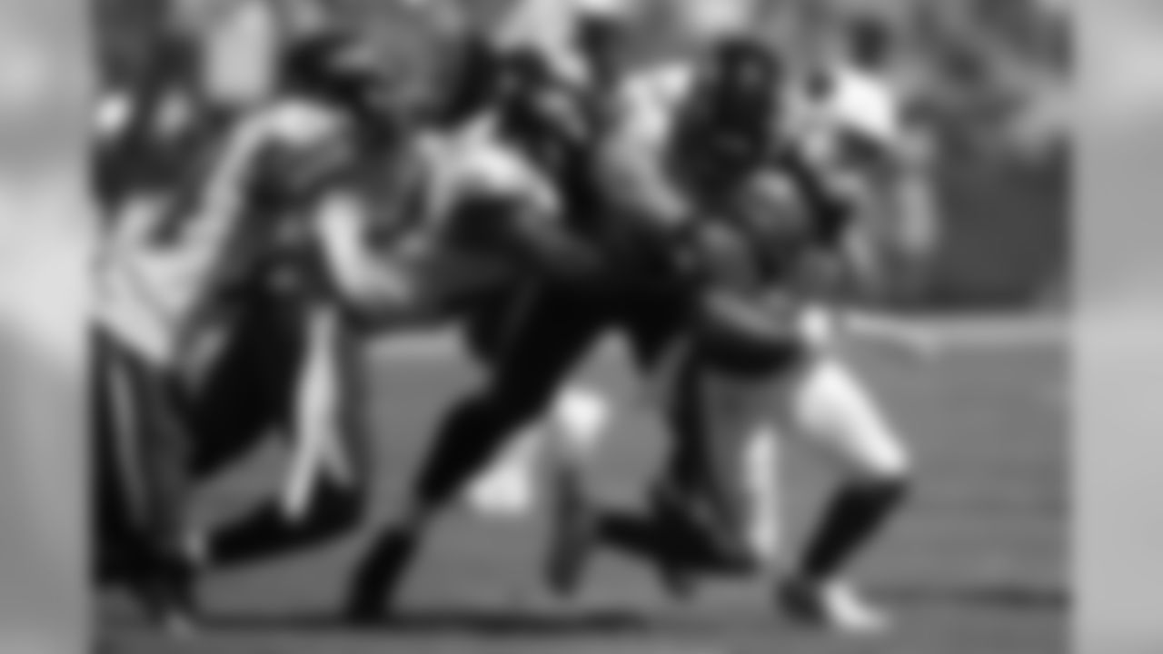 Cardinals wide receiver Damiere Byrd, right, rushes against Baltimore Ravens cornerback Anthony Averett, from left, inside linebacker Patrick Onwuasor and defensive lineman Patrick Ricard.