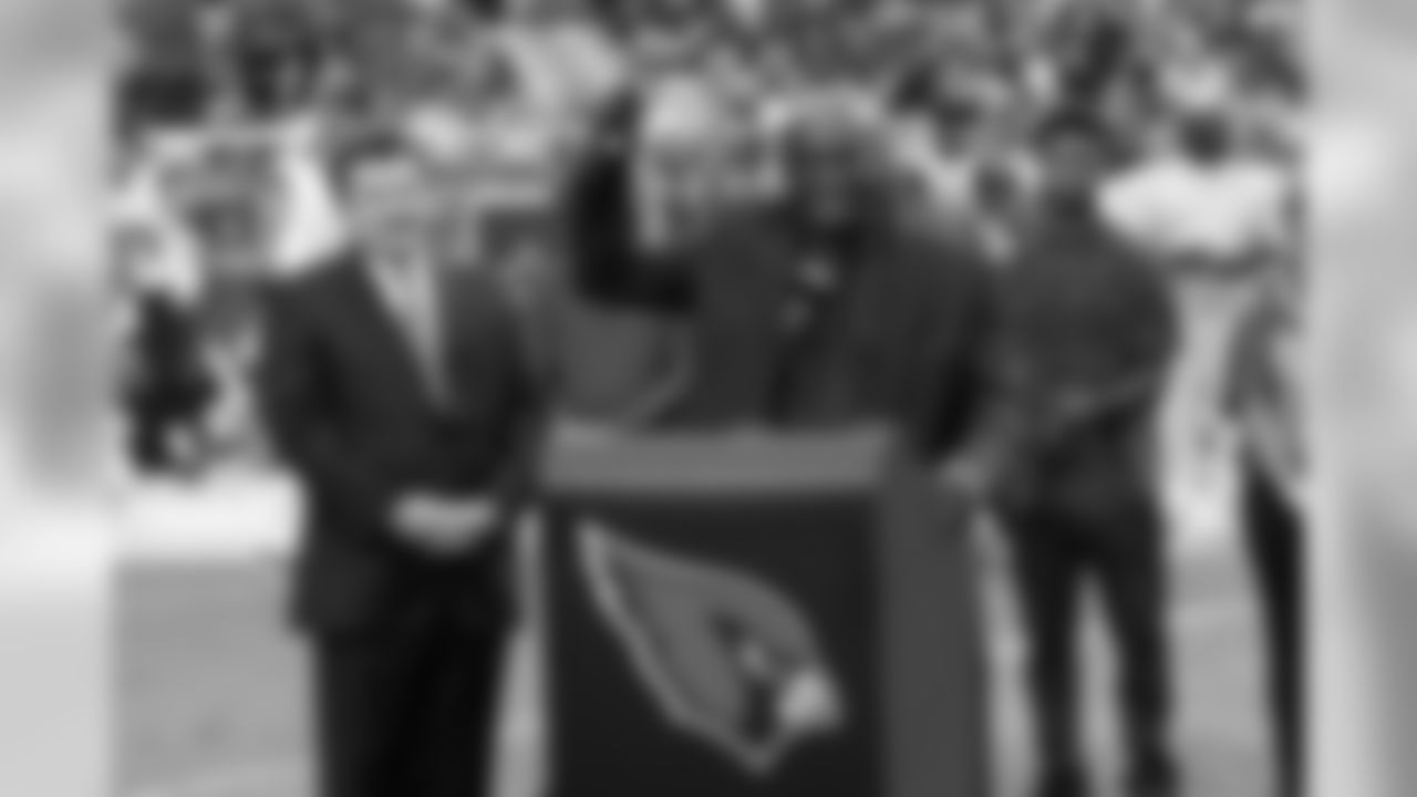Roy Green speaks during his Ring of Honor induction at halftime