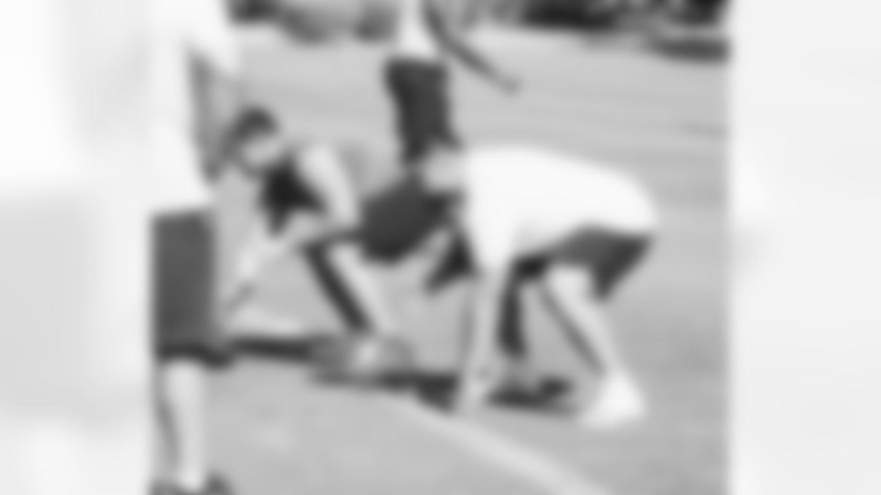 OL Marcus Henry and Will Hernandez work on blocking skills.
