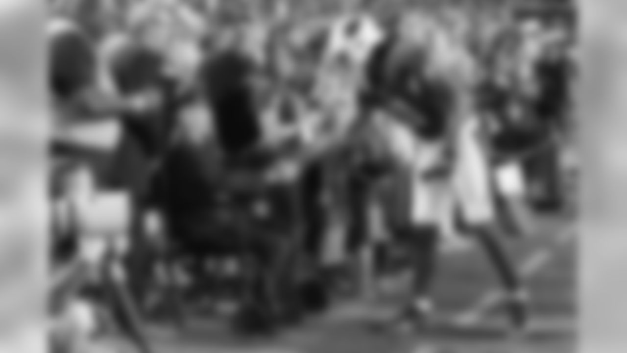 WR Larry Fitzgerald shakes the hand of a veteran.