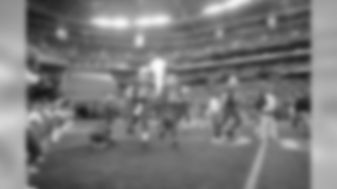 The team runs onto the field before the season finale against the 49ers.