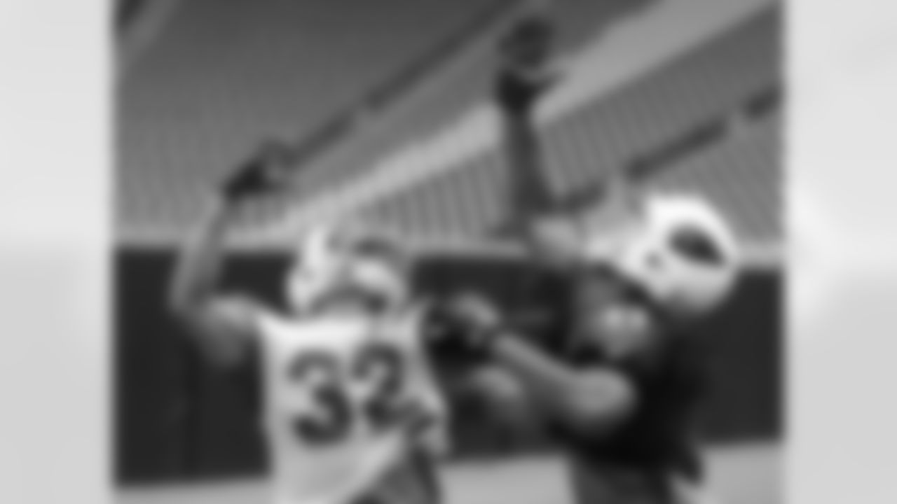 S Tyrann Mathieu and WR Larry Fitzgerald battle for a pass