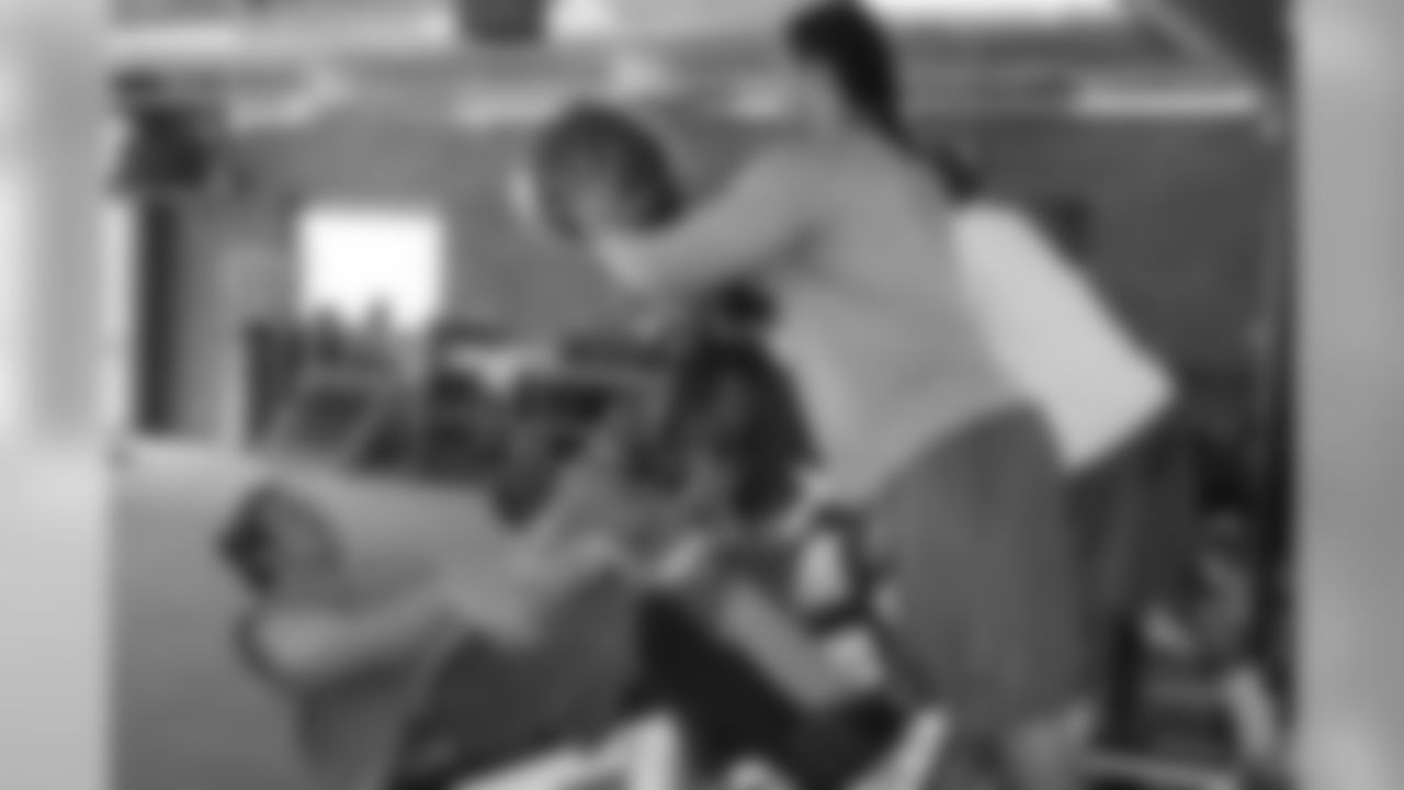 Travis LaBoy and David Holloway work with the medicine ball