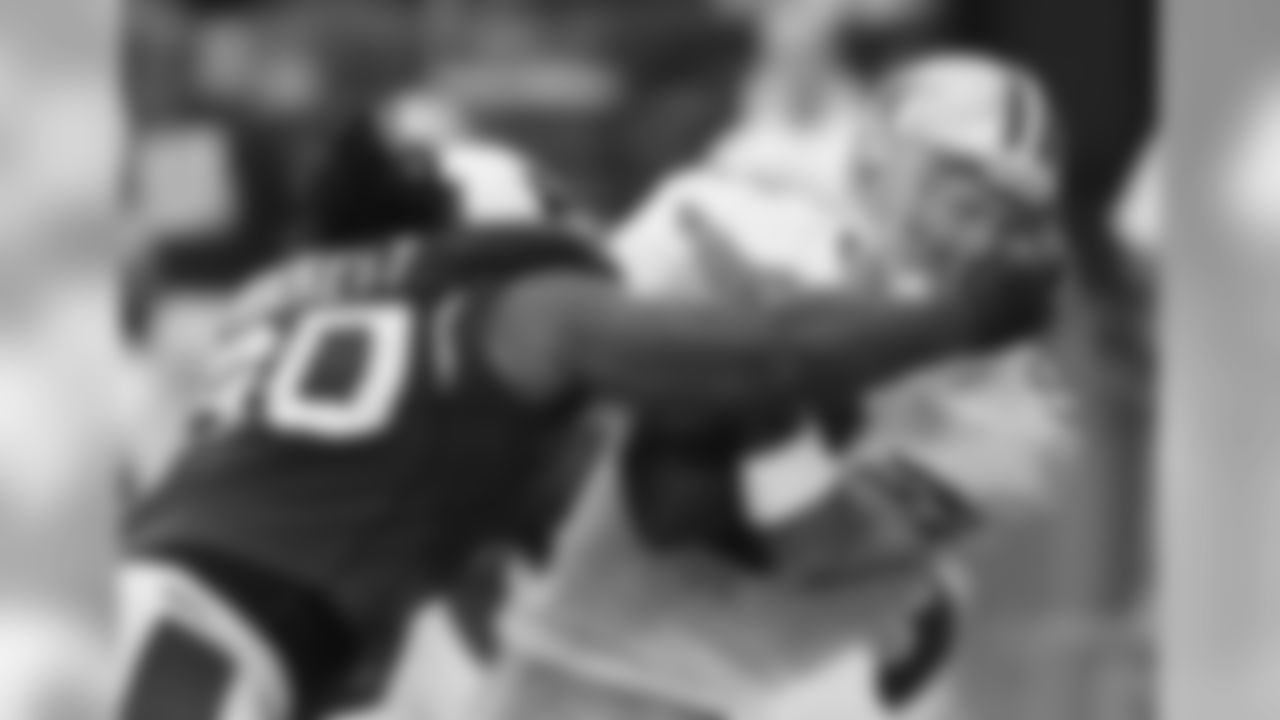 2008: DT Darnell Dockett grabs onto Dallas QB Tony Romo