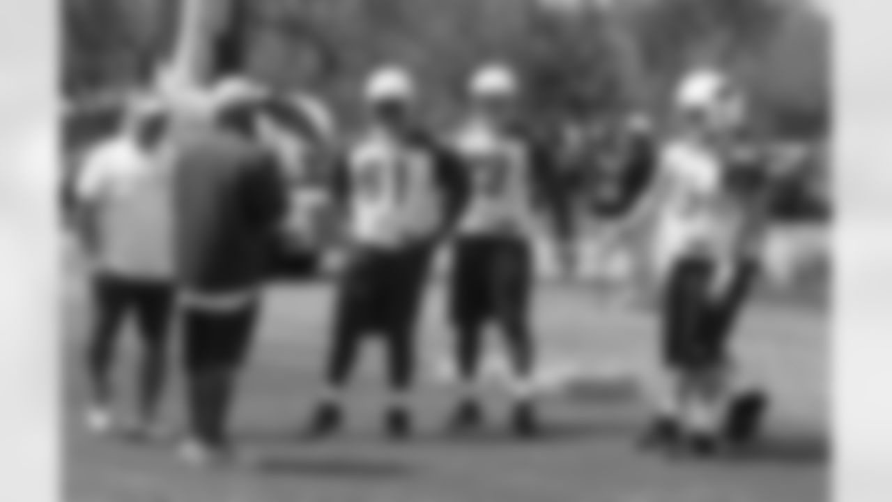 OC Harold Goodwin talks to the offensive linemen