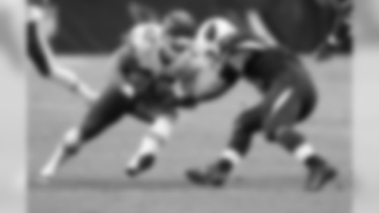 Chiefs LB Anthony Sherman is met by LB Kevin Minter