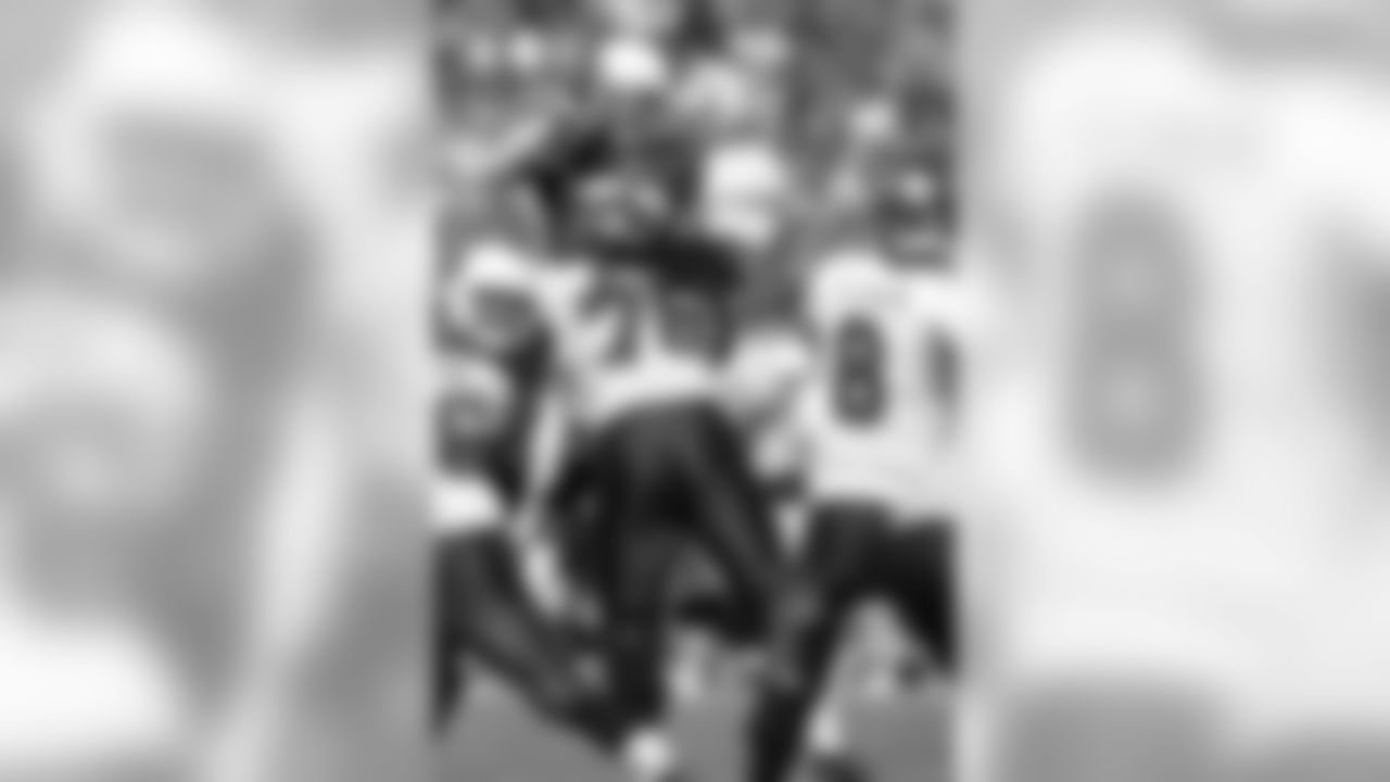 S Tyrann Mathieu jumps near the line of scrimmage against the Buccaneers.