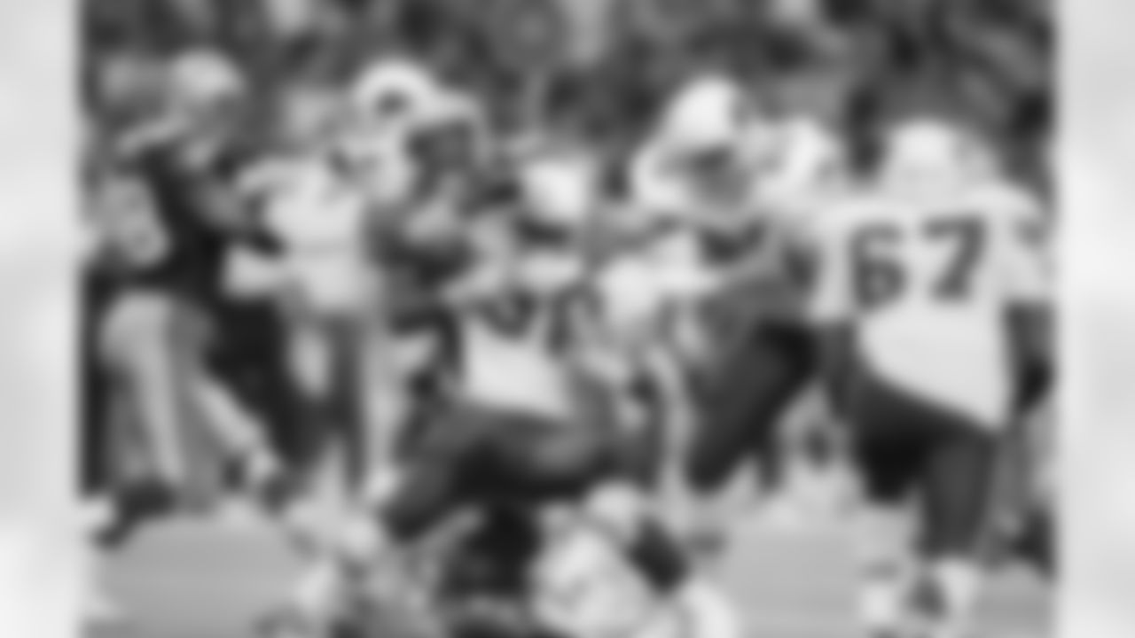 1993: Ron Moore is wrapped up by Cortez Kennedy