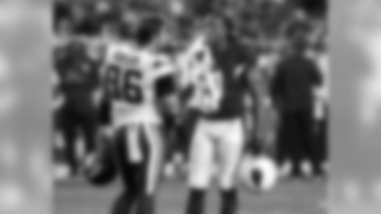 WR Larry Fitzgerald with Vikings DE Brian Robison