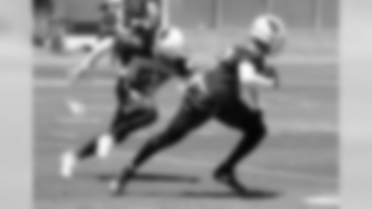 RB D.J. Foster (right) runs away from LB Josh Bynes