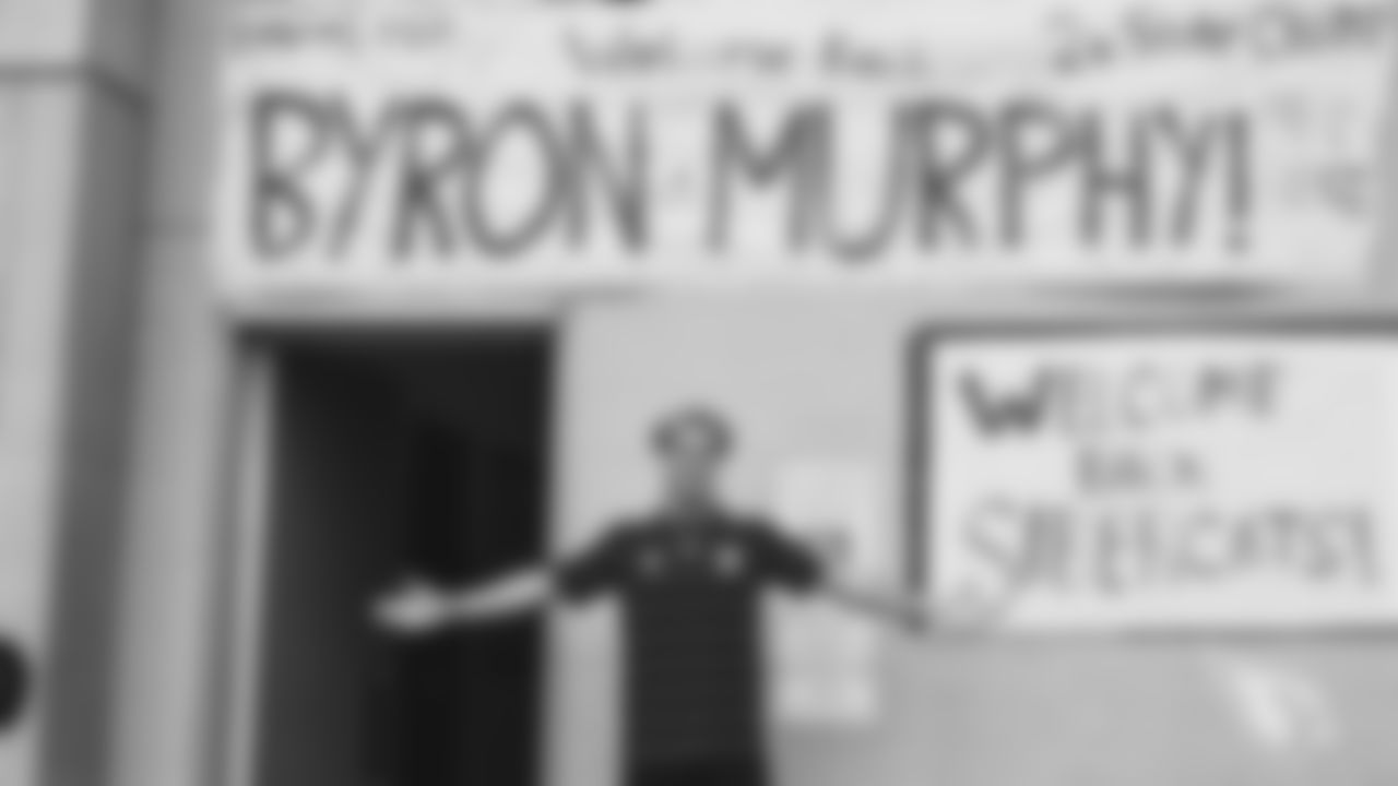 CB Byron Murphy with his 'Welcome Back' sign