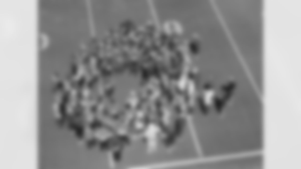 The team huddles together