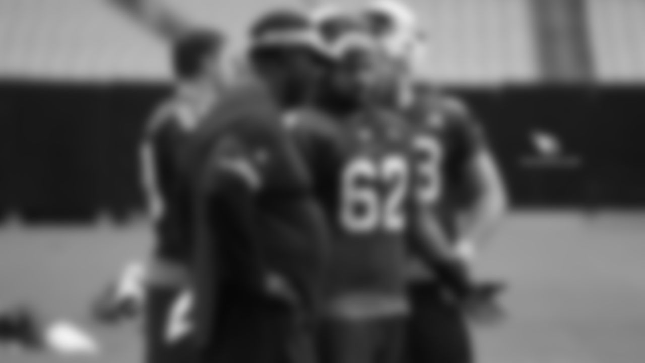 C Daniel Munyer (right) talks with OL coach Ray Brown