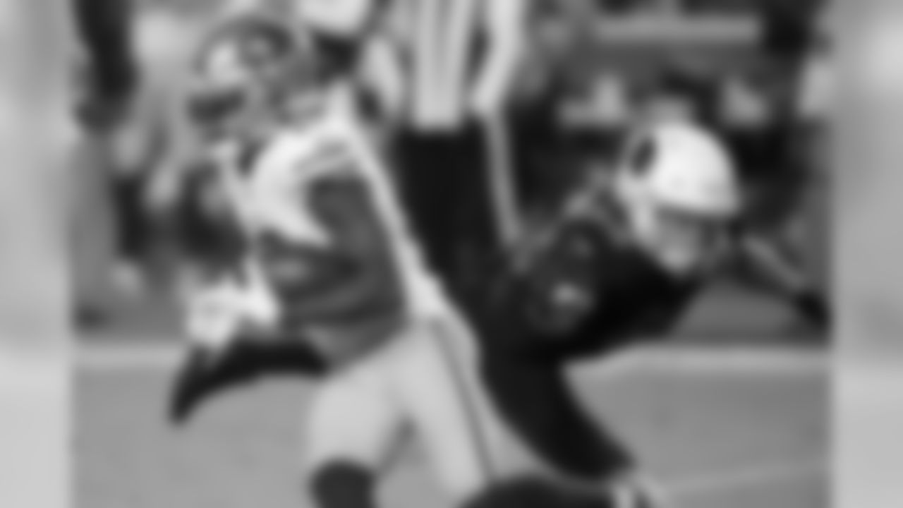 49ers wide receiver Richie James runs as Cardinals linebacker Dennis Gardeck defends.