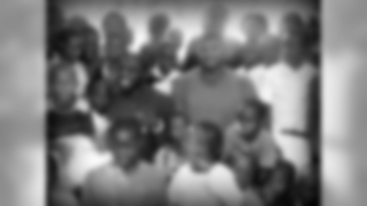 Acho and Campbell take a group photo with the kids in Nigeria