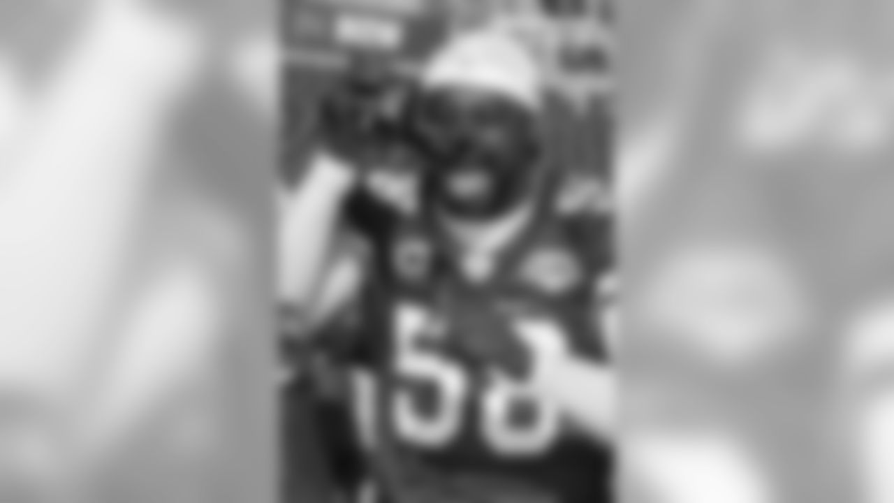 2009: LB Karlos Dansby videotaping at a media session before the Super Bowl.