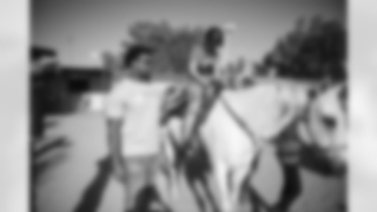 The Arizona Cardinals visit Hunkapi Farms to work with therapy horses and families with ALS on Saturday, May 13, 2023 in Scottsdale, AZ.