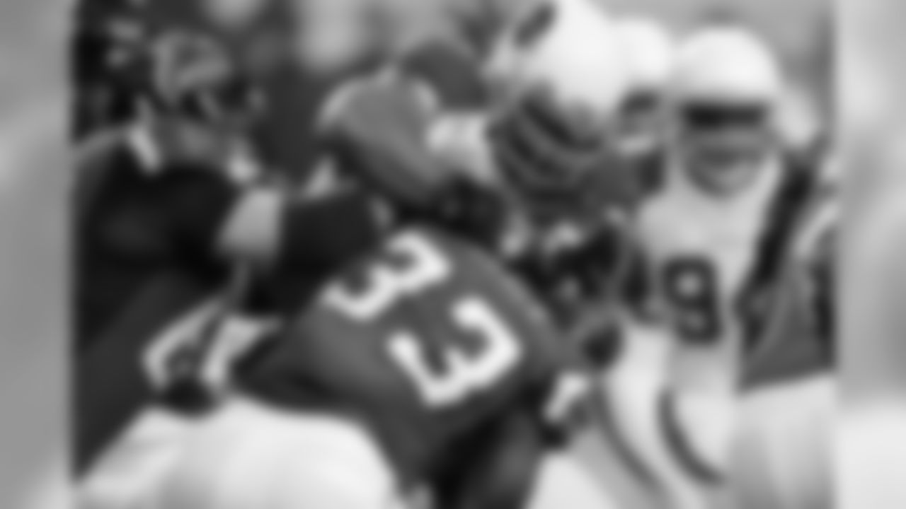 Dockett wrestles Michael Tuner to the ground