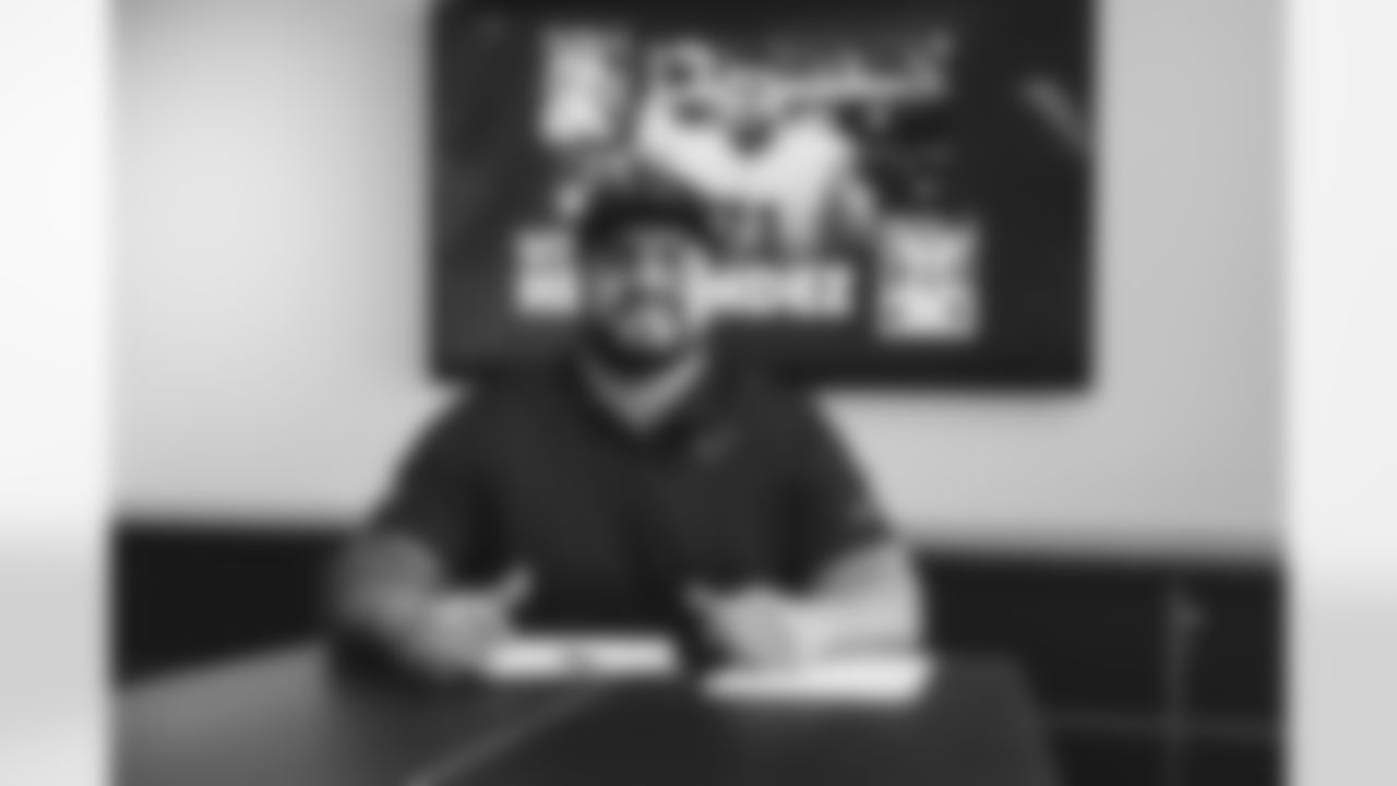OL Will Hernandez smiles after signing his new contract.