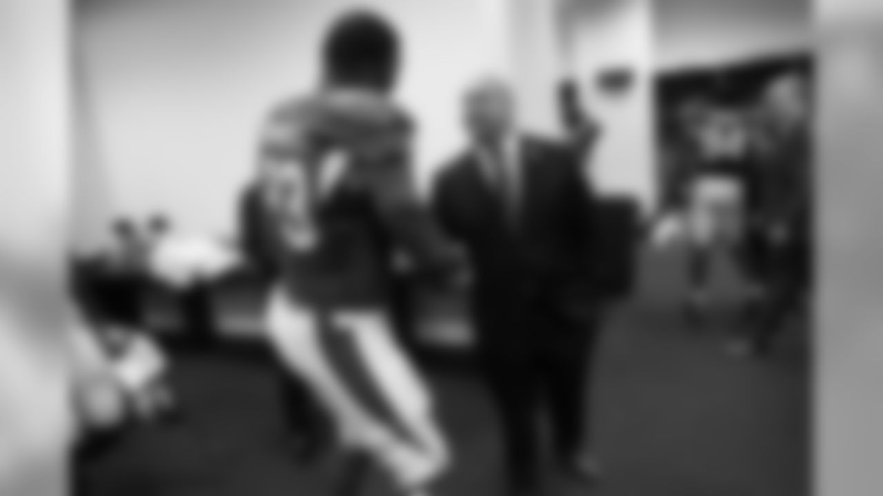 Keim congratulates defensive end Calais Campbell after the Cardinals' 2013 win in Seattle