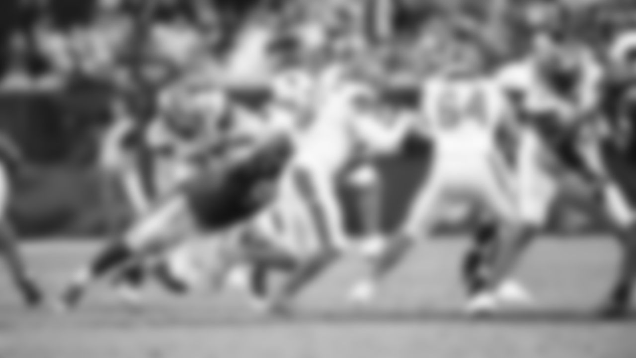 DT Corey Peters lunges for Browns QB Baker Mayfield.