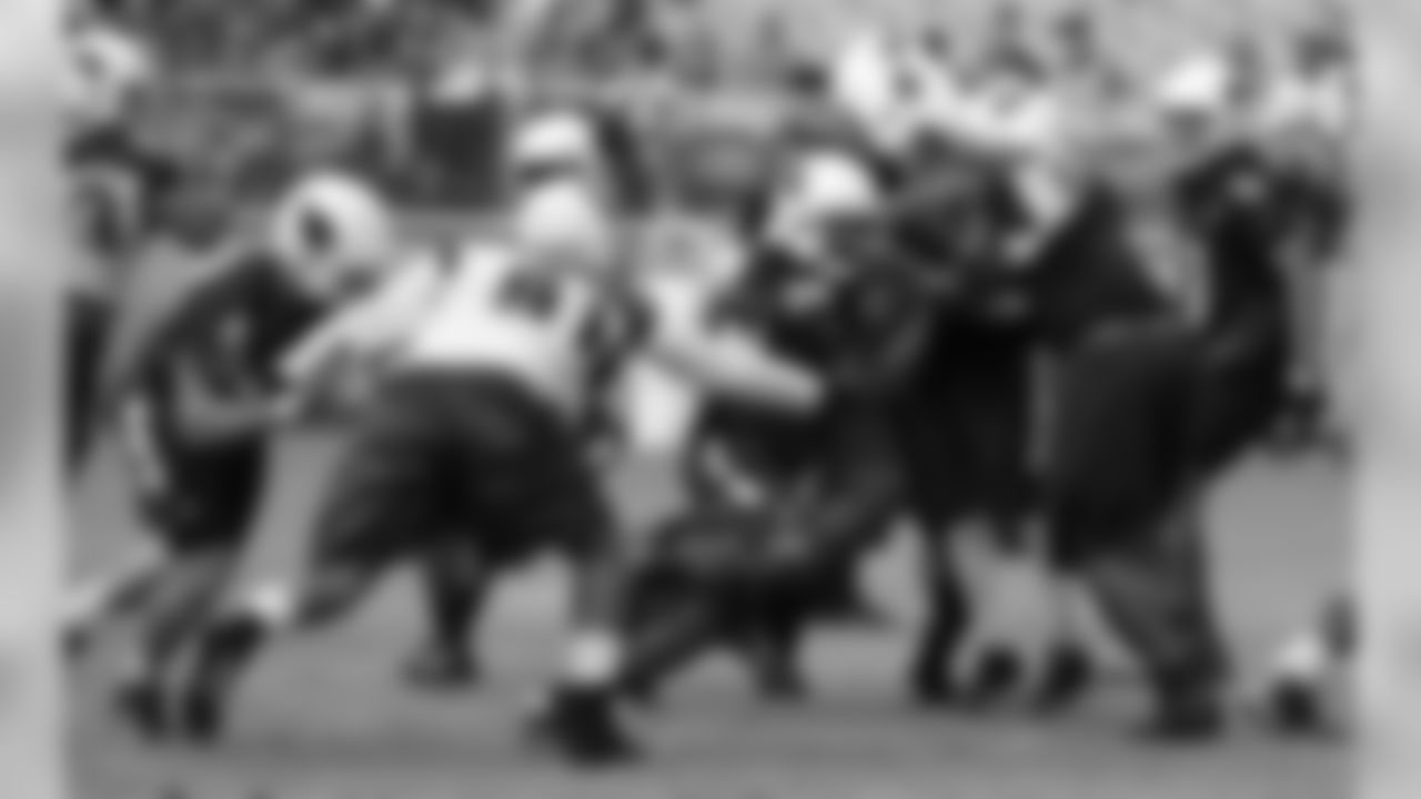 RB Andre Ellington runs through the line