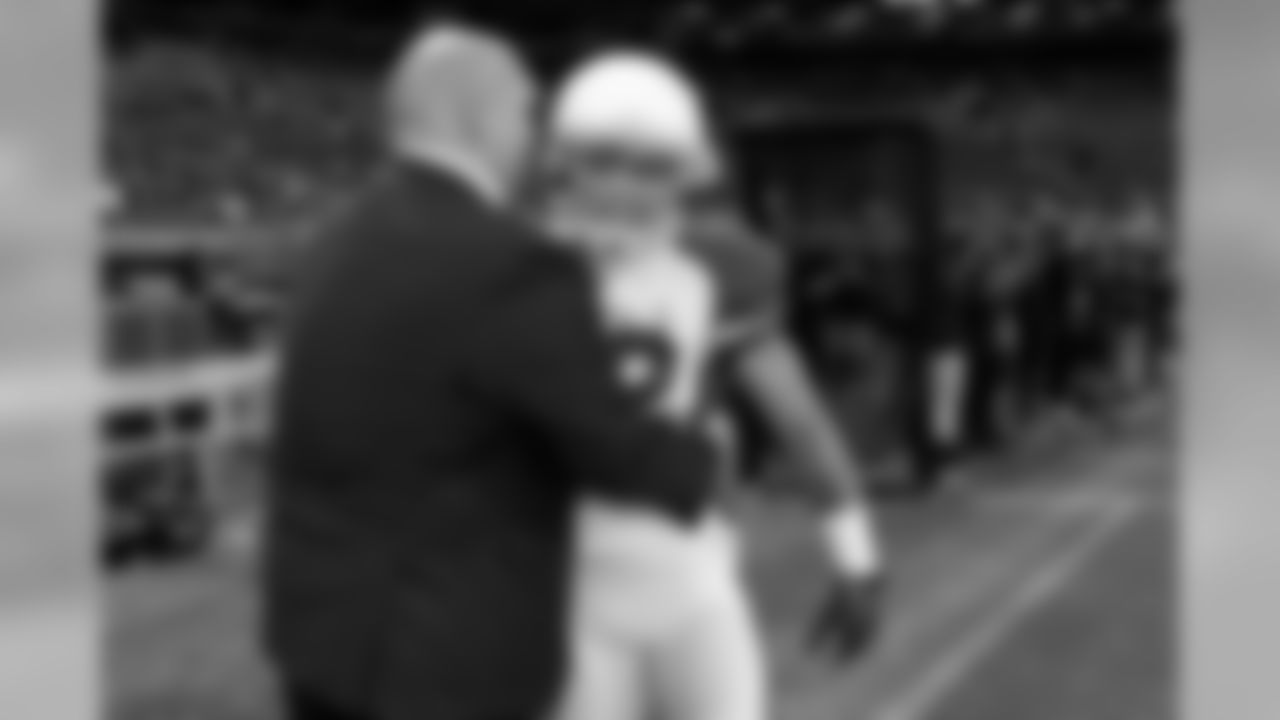 GM Steve Keim hugs S Tyrann Mathieu.