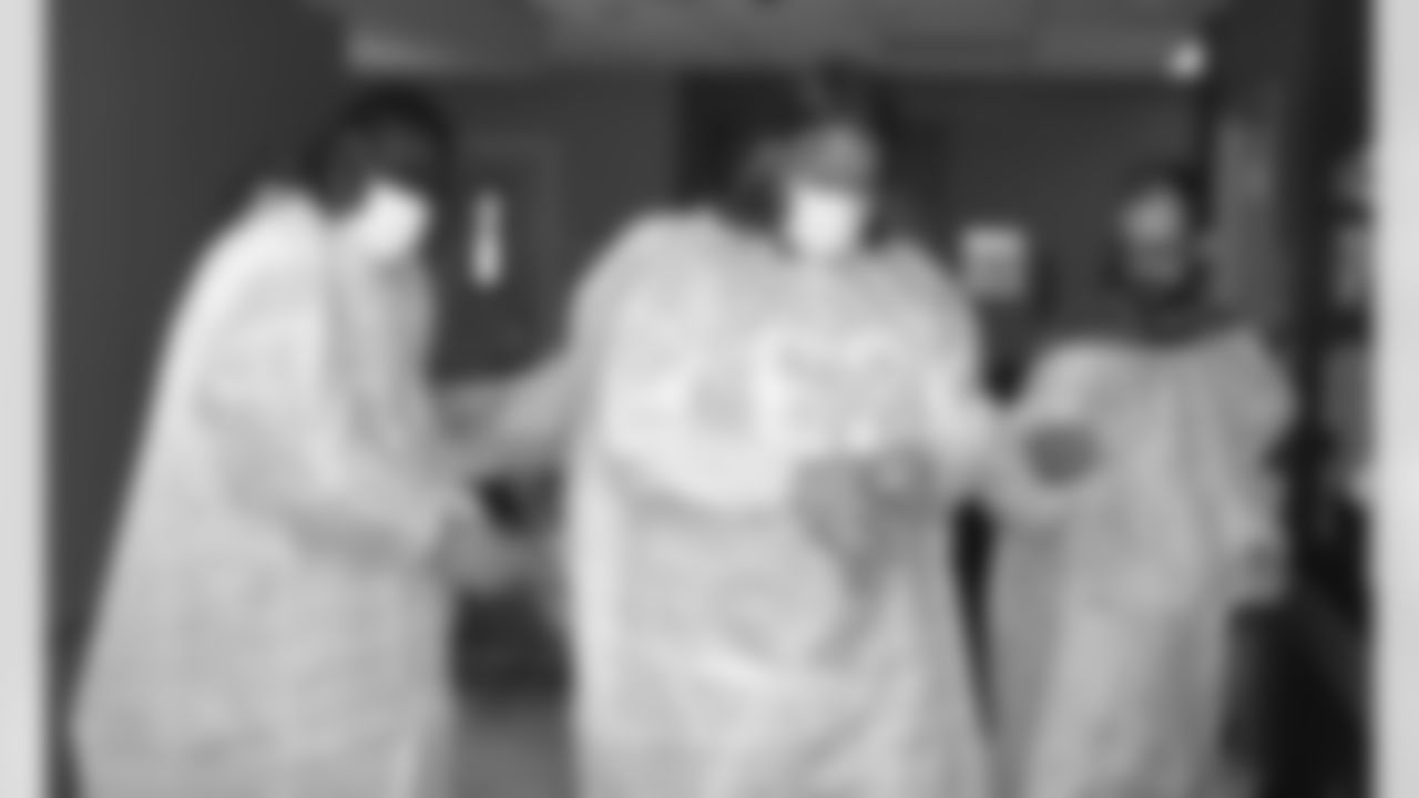 Offensive linemen Lyle Sendlein and Earl Watford prepare to enter a hospital room.