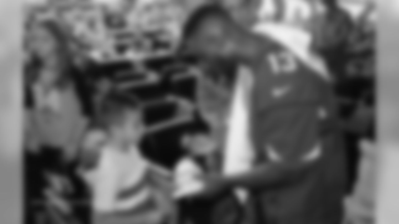 WR Jaron Brown signs an autograph