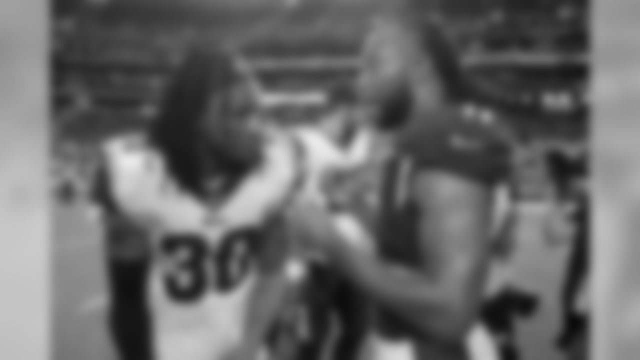 Rams running back Todd Gurley (left) greets Cardinals wide receiver Larry Fitzgerald after the game. The Rams won 34-7.