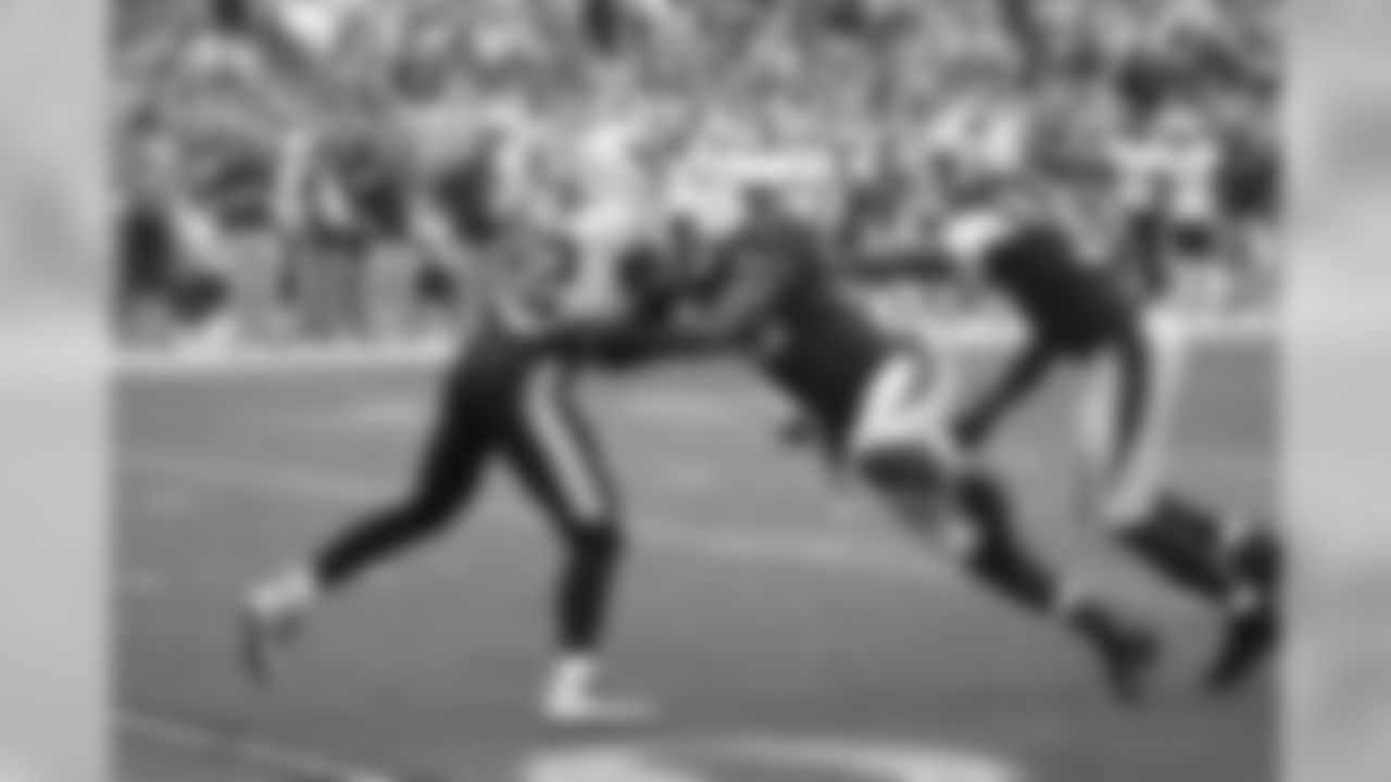 DL Olsen Pierre with a sack
