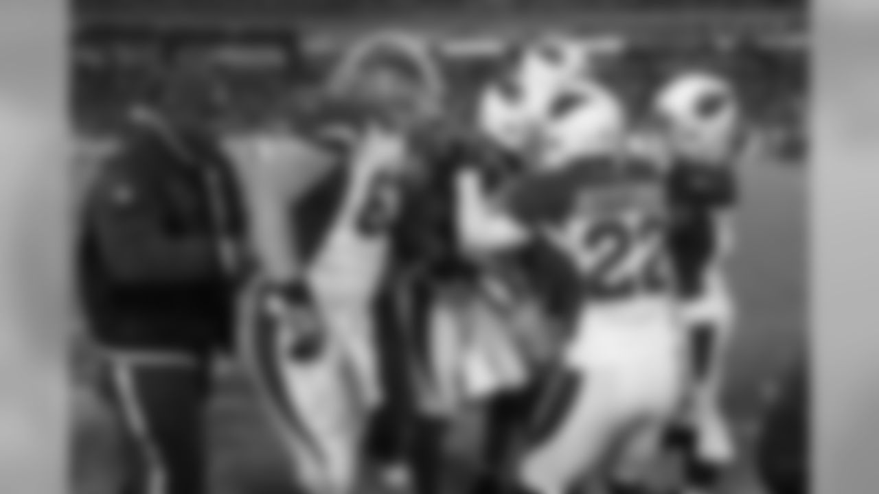 CB Antoine Cason is mobbed by teammates after his interception return for a touchdown against the Titans.