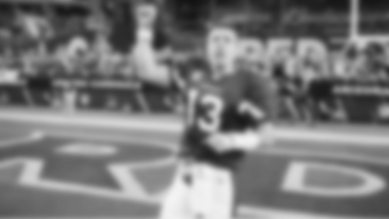 QB Kurt Warner gestures to the crowd after the game.