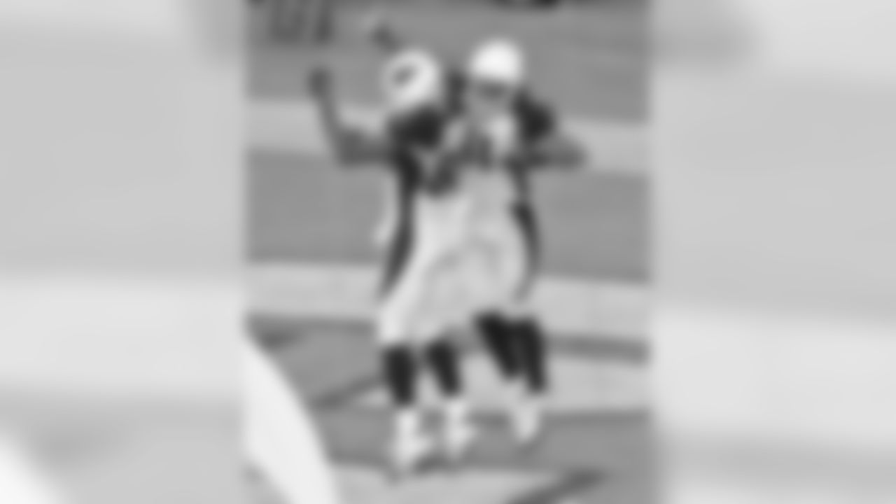 2005: WR Larry Fitzgerald celebrates a touchdown with Bryant Johnson.