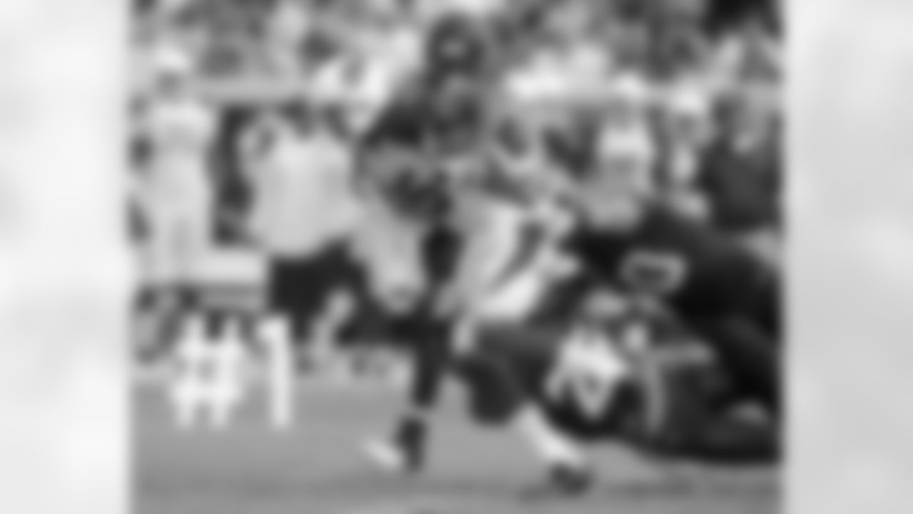 WR Michael Floyd shakes off two tacklers en route to a 91-yard touchdown catch.