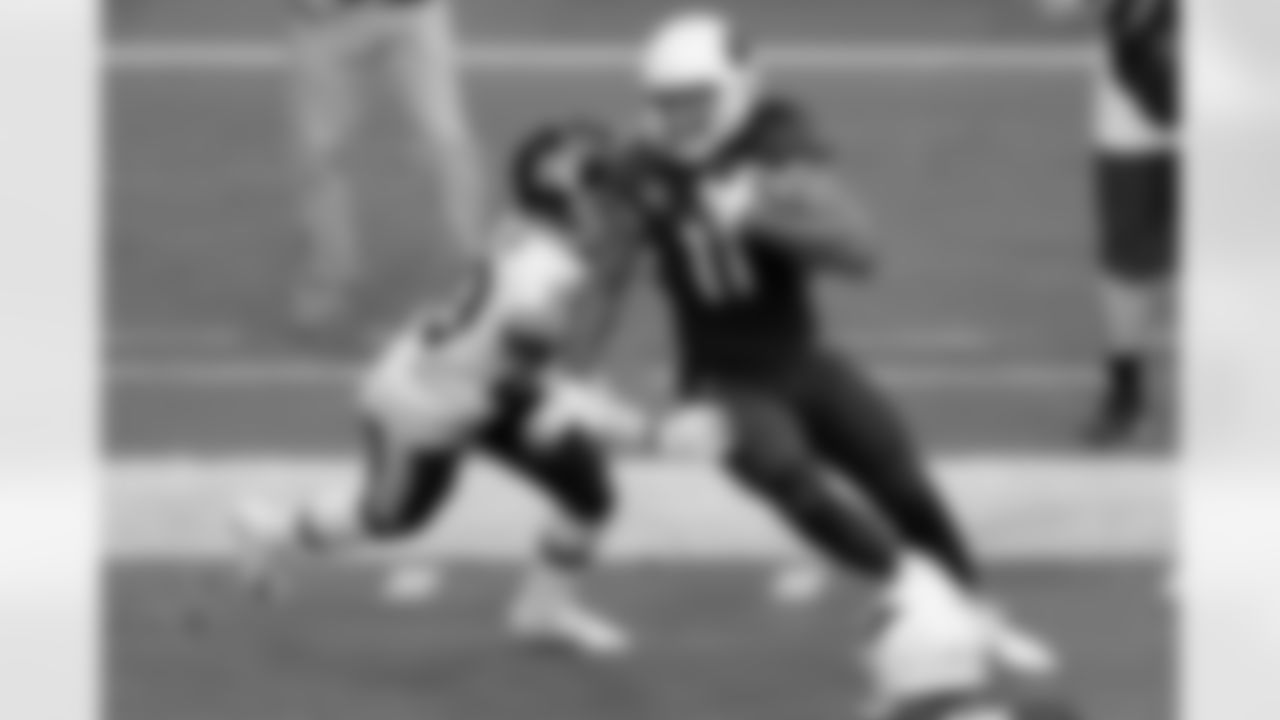 Arizona Cardinals wide receiver Larry Fitzgerald (11) is hit by Washington Football Team cornerback Jimmy Moreland (20).