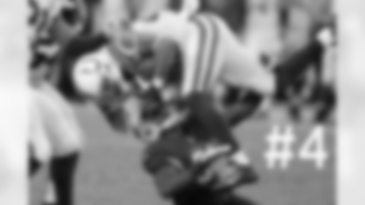 David Reed is tackled by Justin Bethel.