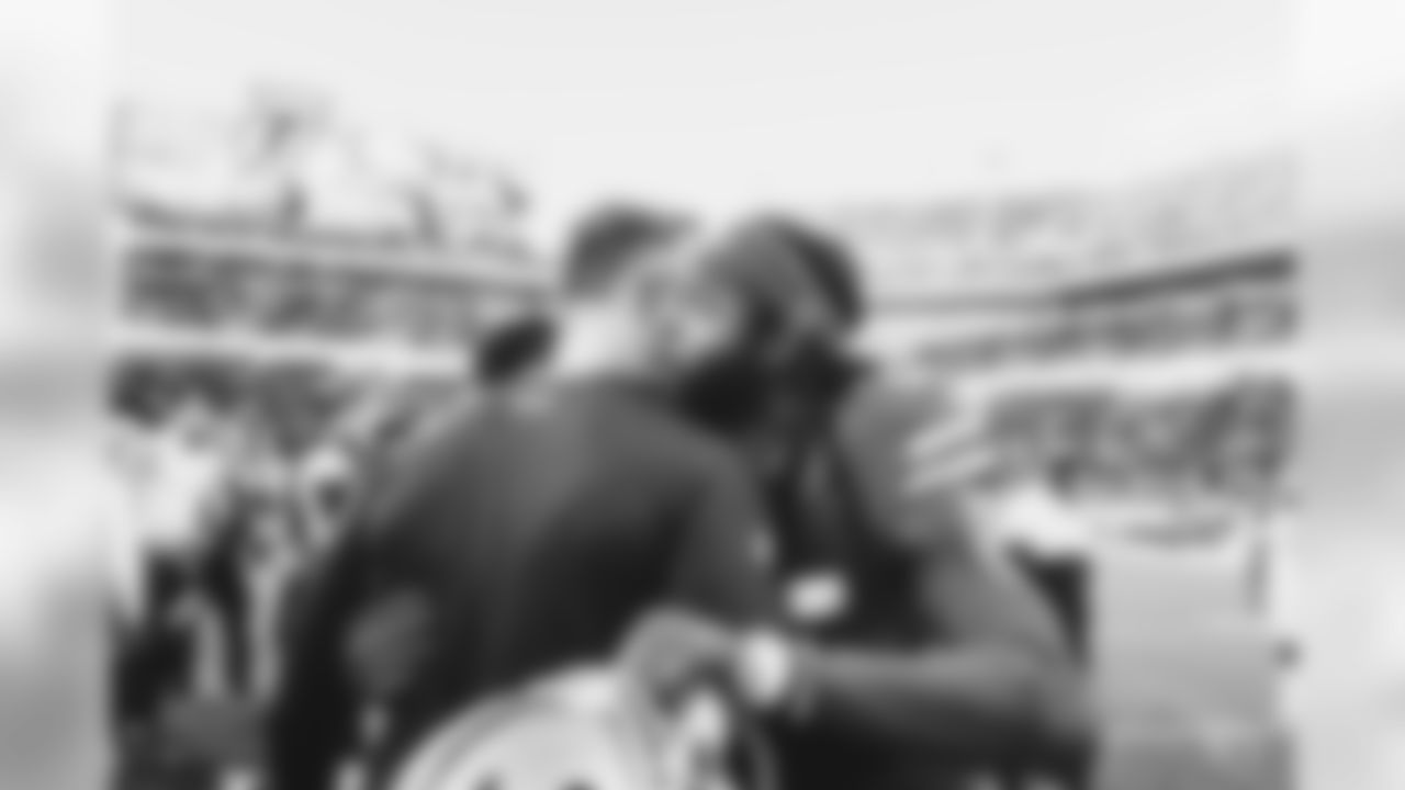 Coach Kliff Kingsbury with 49ers CB Richard Sherman