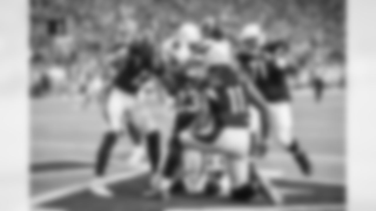 In his first appearance as an Arizona Cardinal, RB Adrian Peterson scored two touchdowns, including this one he celebrated with teammates that concluded the first drive of the game