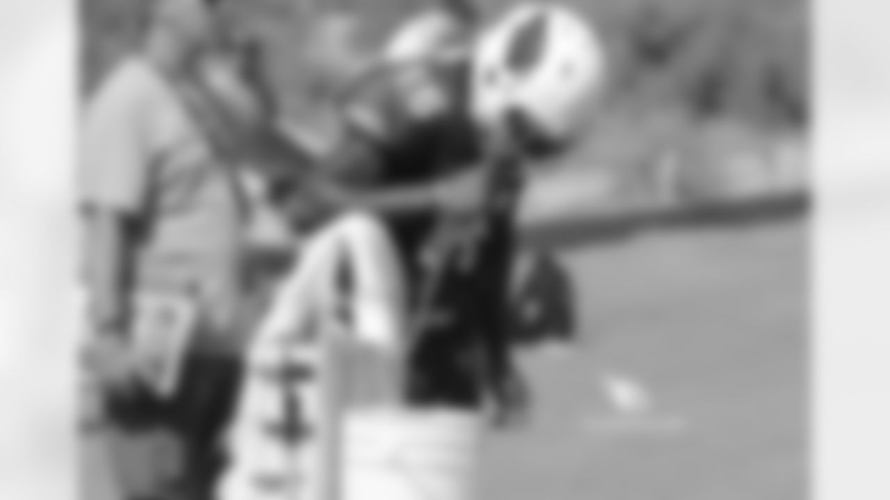 Day 9: WR Chad Williams hydrates during a break in the action