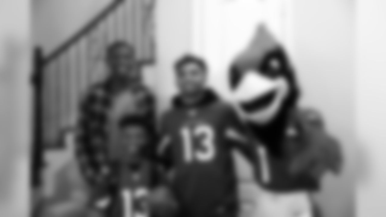 Images of Cardinals receiver Christian Kirk delivering surprise Super Bowl tickets to Devin Manigo at his home in Texas