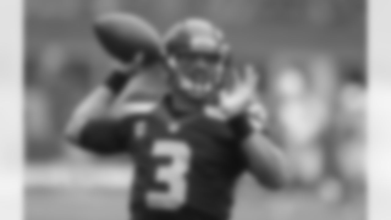 Russell Wilson warms up before the game.