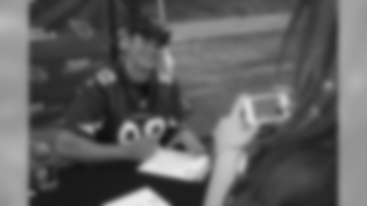 Signing autographs for fans