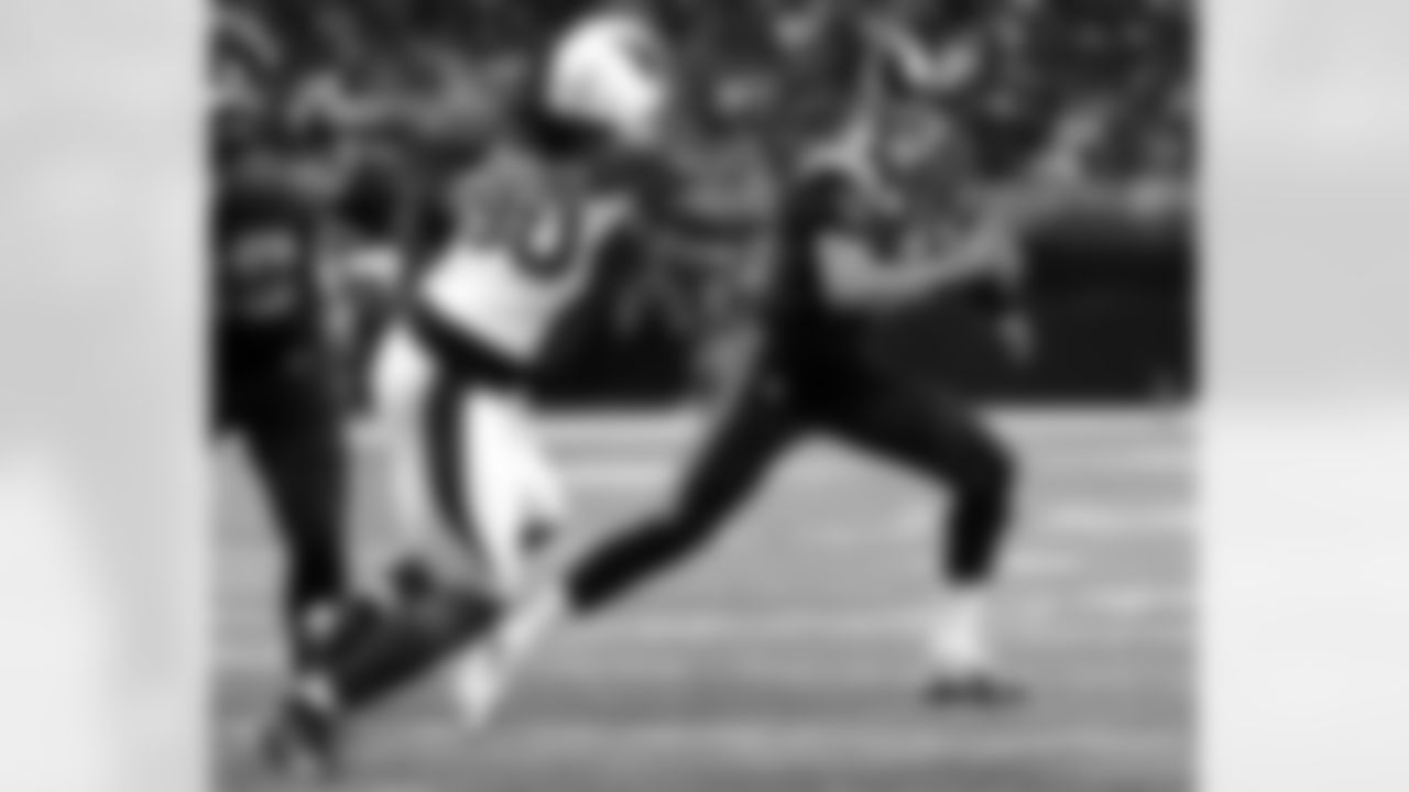 2012: DT Darnell Dockett rushes Rams QB Sam Bradford