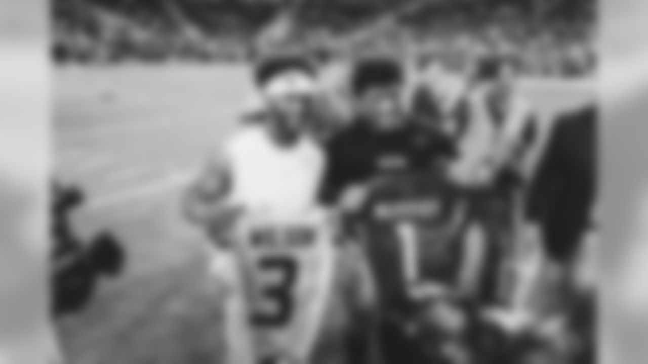 QB Kyler Murray swaps jerseys with Seahawks QB Russell Wilson.