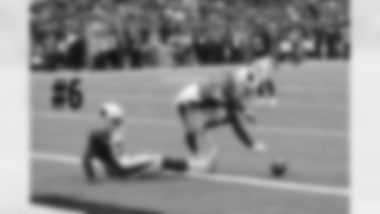 S Budda Baker (left) and CB Justin Bethel pin the Texans at the 1