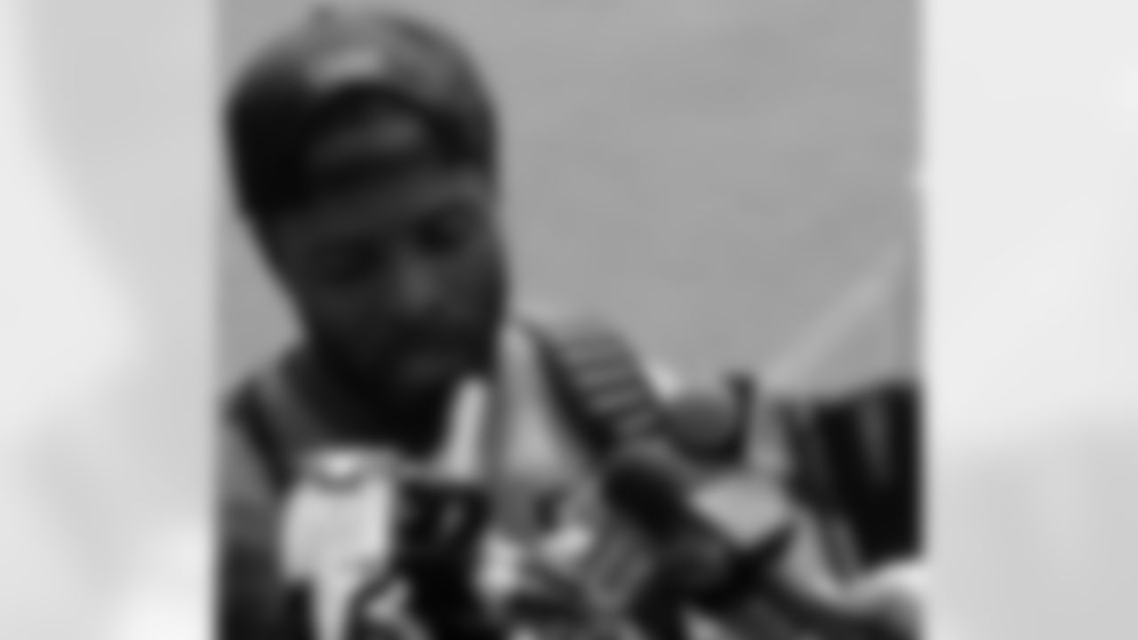 CB Jerraud Powers talks with the media