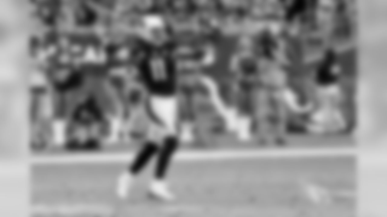 WR Larry Fitzgerald throws a pass.