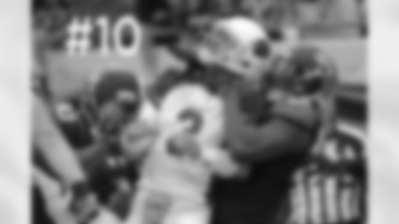 Jaguars DE Andre Branch grabs Carson Palmer after a pass is thrown.